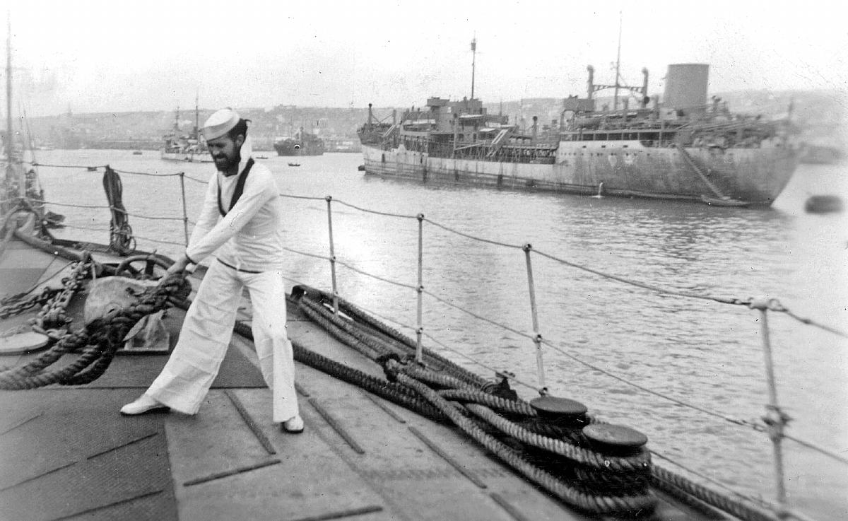 Fred Hollands on upper deck in whites