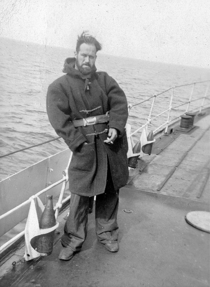 Fred Hollands in greatcoat on upper deck of HMCS Skeena